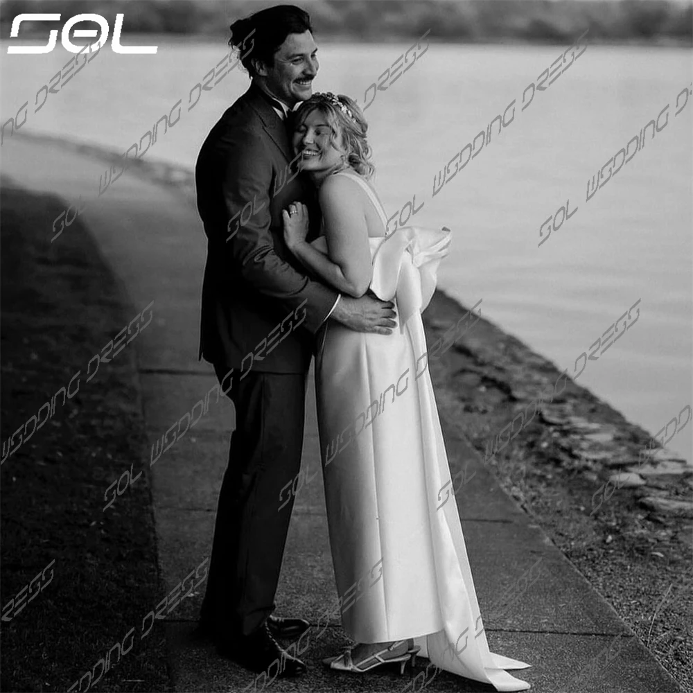 Рисунок 2 - Женское атласное свадебное платье с большим бантом