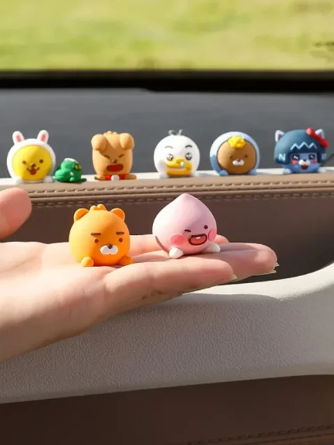 Add cuteness and charm to your car with the Anime Figure Kakao Friends Model Dolls Figurine Car Decoration.