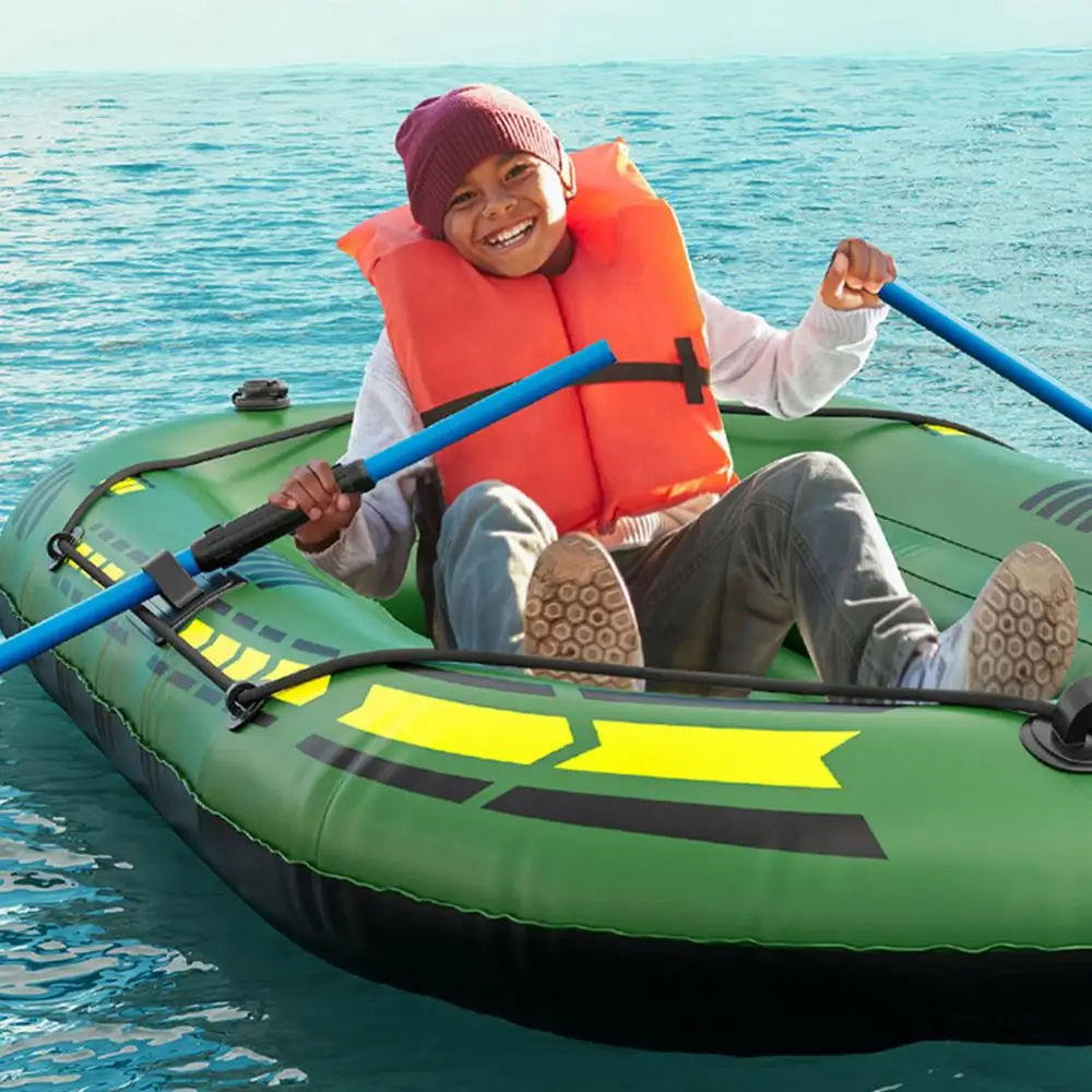 A young boy riding in an inflatable raft designed for shallow waters.