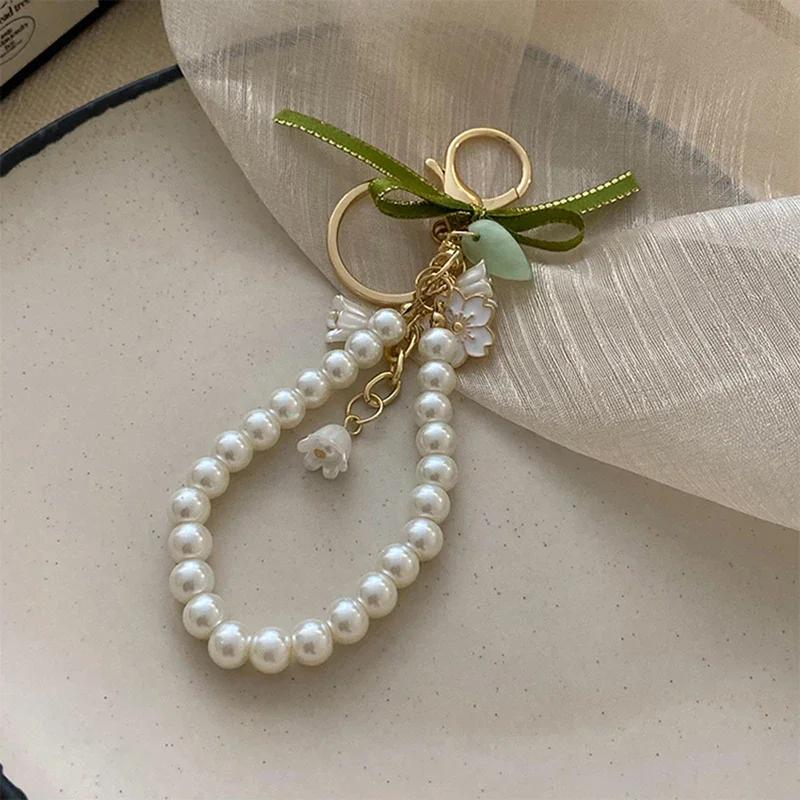 Fresh and Elegant Bell Orchid Keychain: Green Imitation Pearl and Leather Resin Alloy Accessory