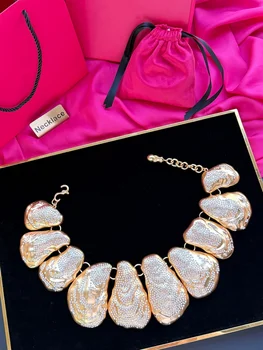 This is a trendy, individualistic, abstract, and fashionable necklace with a highly crafted gold-plated finish 1