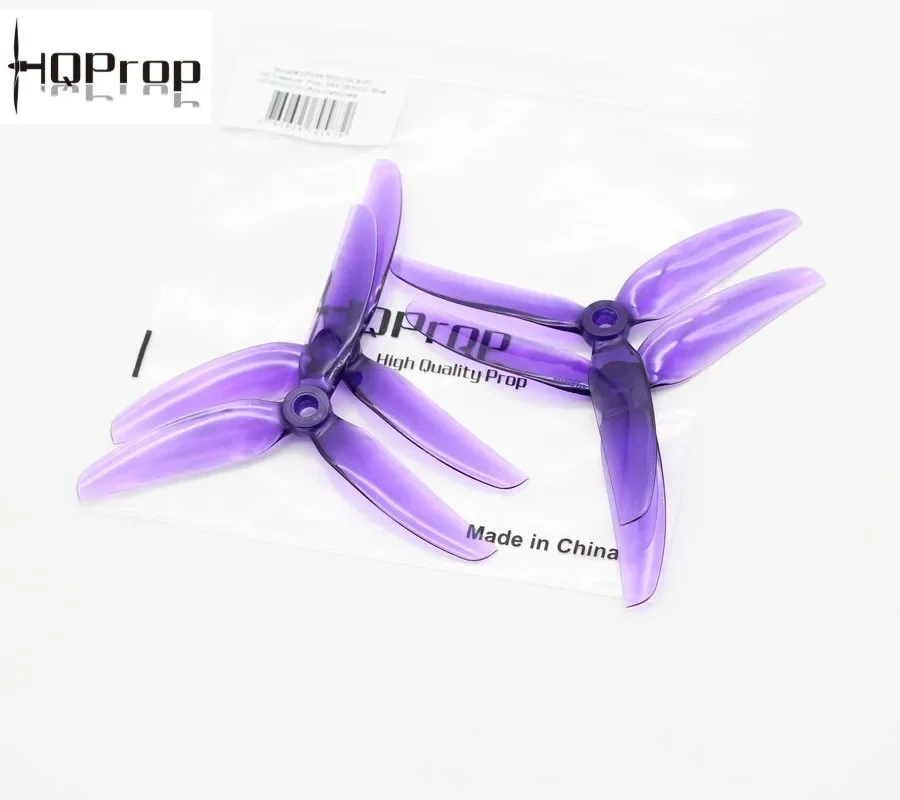 Hélices drone course multicolores disposées en éventail, idéales pour un vol haute performance en compétition.
