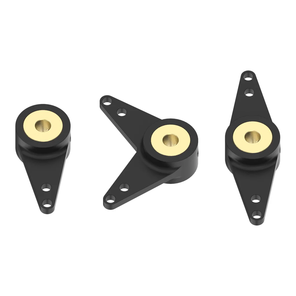 Bras oscillant en nylon 3mm pour bateau RC posé à côté d'une règle pour l'échelle