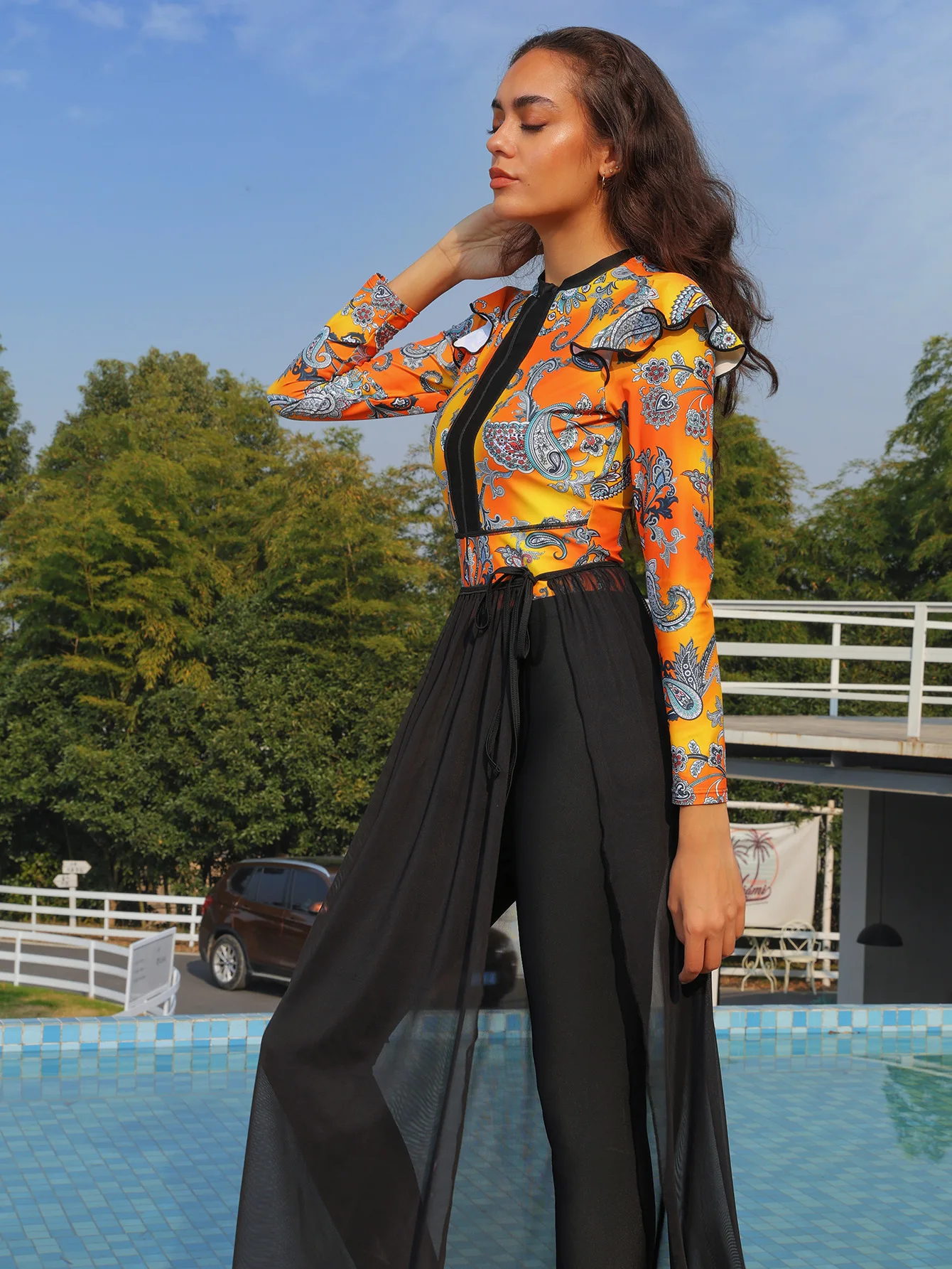 Layered look showing sheer modesty skirt flowing over black swim leggings