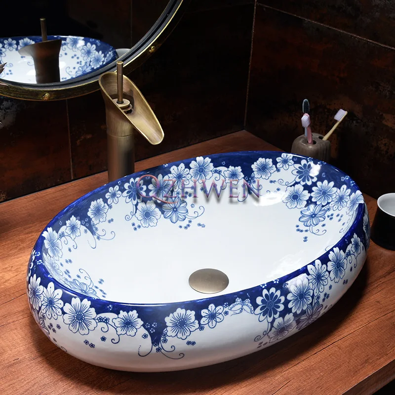 

China Blue and White Porcelain Ceramic Washbasin Oval Sink Bathroom Easy Clean Balcony Countertop Art Basin with Tap 60*40*14cm