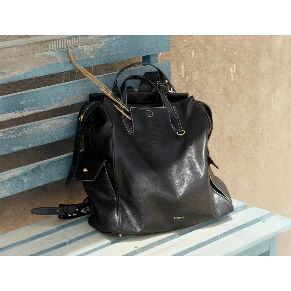 At the foot of Mountain, there is a backpack called series large unisex vegetable tanned leather_voghion.com