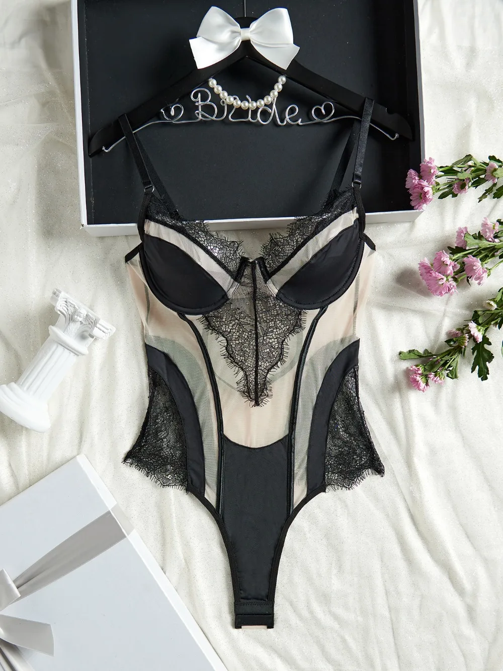 black bodysuit with embroidered mesh detail