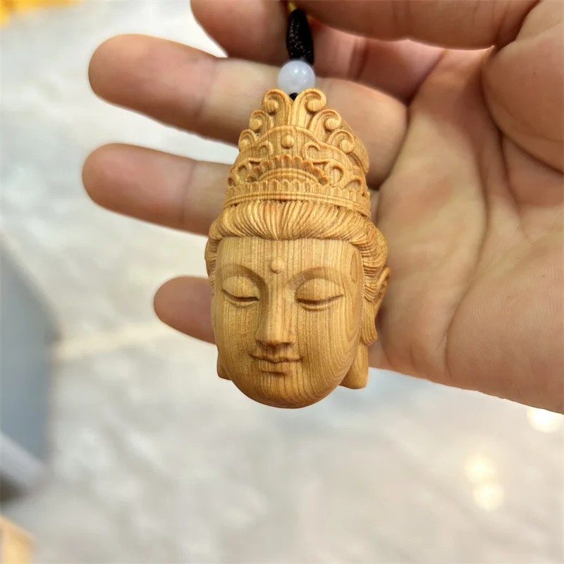 

Boxwood carving Guanyin Buddha text play men hand play a piece of handicraft solid wood creative pendant buddha statue