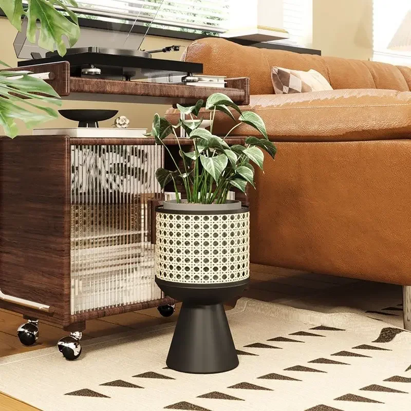 A Minimalist Iron Art Indoor Potted Plant Stand with A Mobile Design Resembling Rattan Weaving Desktop Flowerpot