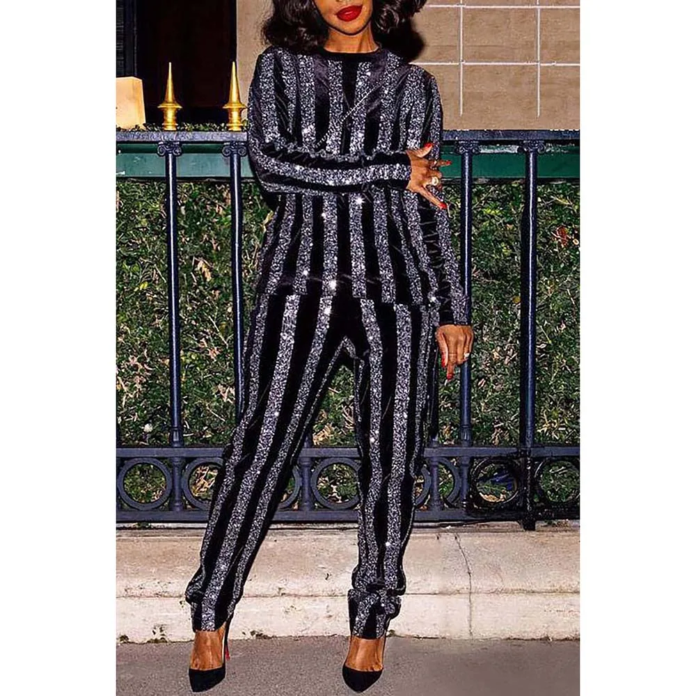 Женский трикотажный брючный костюм в черную полоску