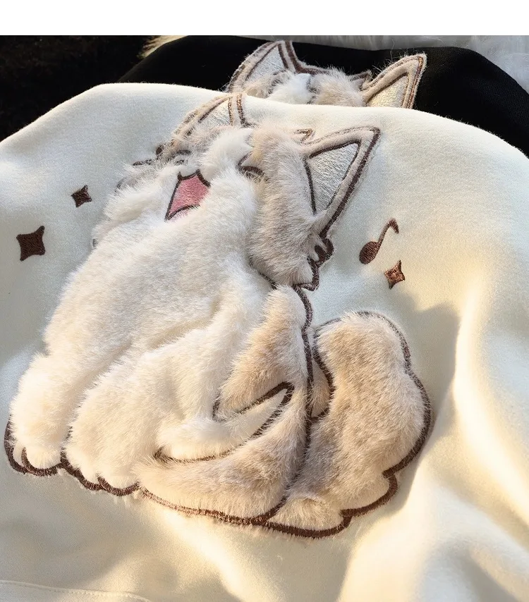 close up of the plush cat design detail on a cat themed hoodie