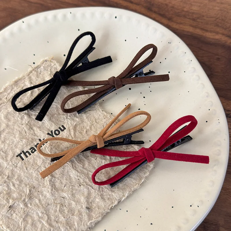 Side suede red bow bangs hairpin forehead headdress women's word clip edge clip autumn and winter 2024 new