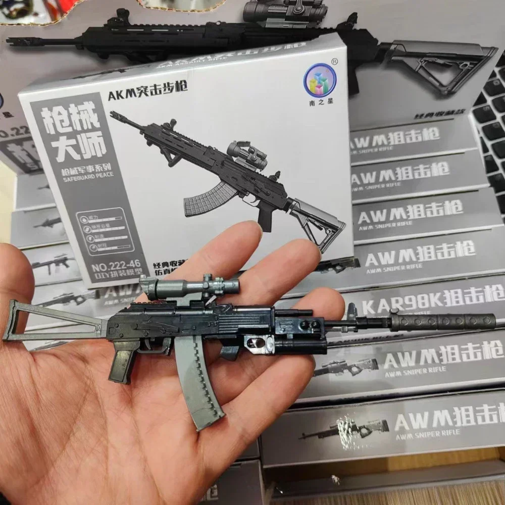 Kalashnikov assault rifle ak74 in male hand isolated on a black