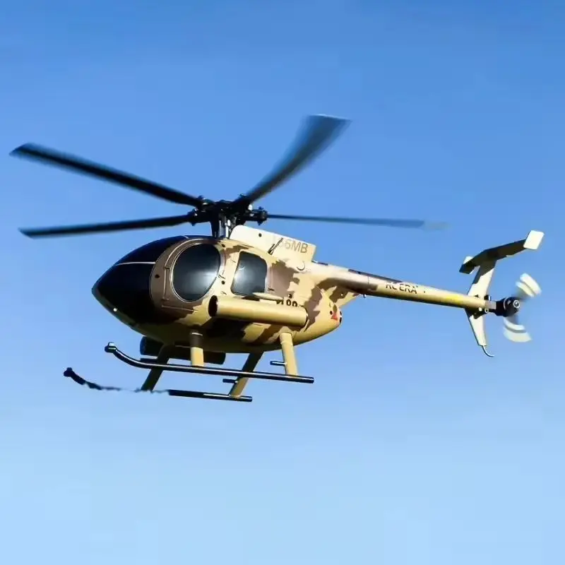 Hélicoptère RC télécommandé Red-1B en action, volant dans un parc avec un pilote utilisant la télécommande.