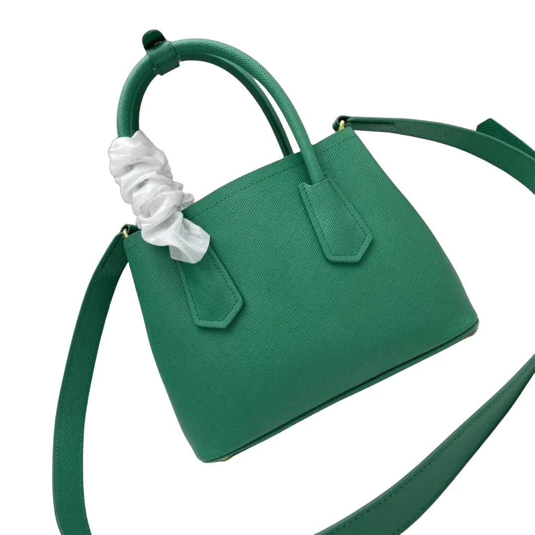 

Genuine leather handbag with detachable shoulder straps that can be worn on one shoulder or across the body