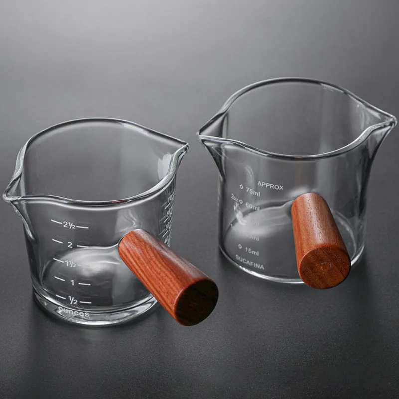 https://ae01.alicdn.com/kf/Sde57f6ac75684e1cbbb910d613303e9fg/Leeseph-Double-Spouts-Coffee-Measuring-Cup-with-Wooden-Handle-Heat-Resistant-Espresso-Shot-Glasses-for-Milk.jpg