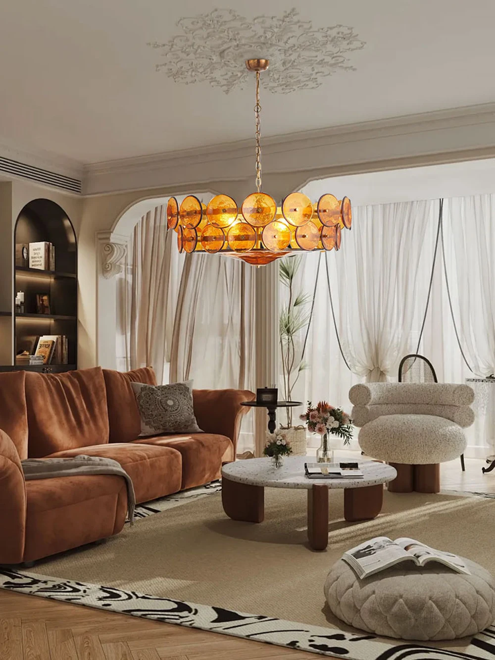 A stylish living room with a brown sofa, marble coffee table, plush accent chair, and an Italian Retro Pendant Light, with sheer curtains letting in natural light.