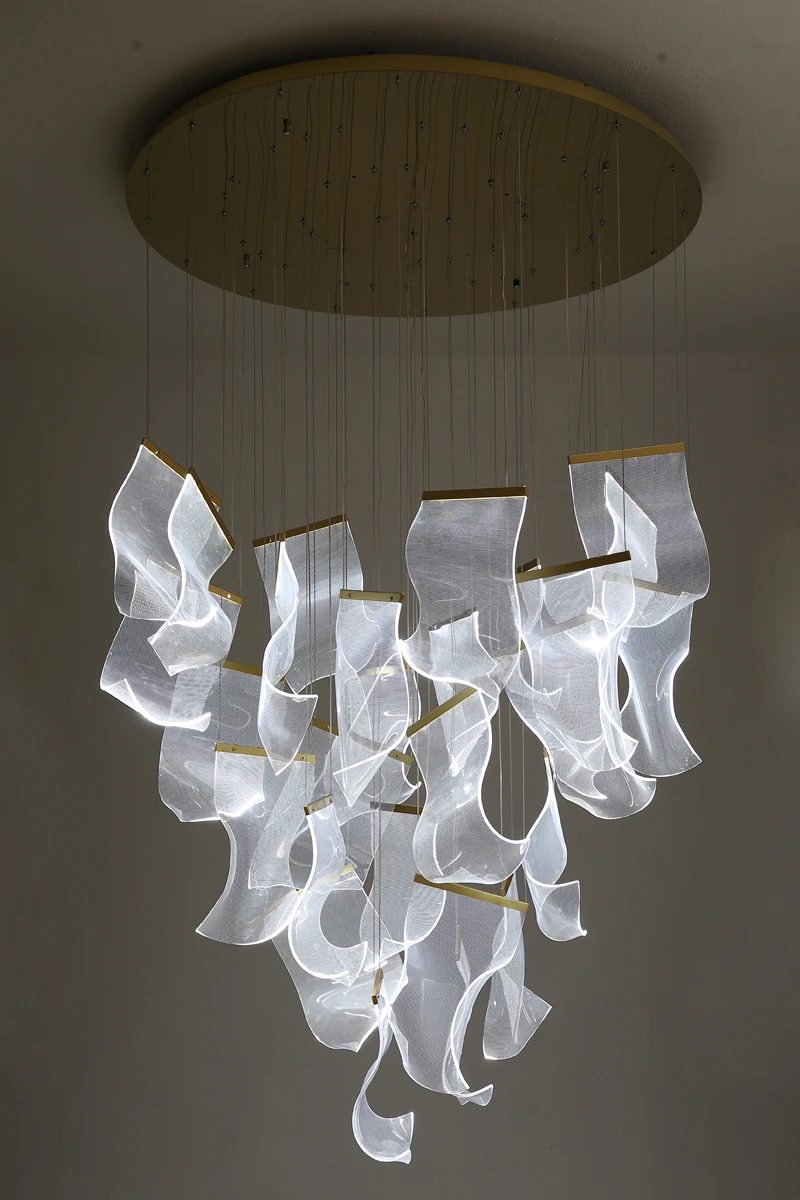 A glamorous chandelier that illuminates a home with an abundance of white lights.