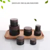 1X 5/10/20/30/50/60/100g Empty Black Glass Refillable Bottles Makeup Jar Pot Travel Face Cream Lotion Vials Cosmetic Containers 4