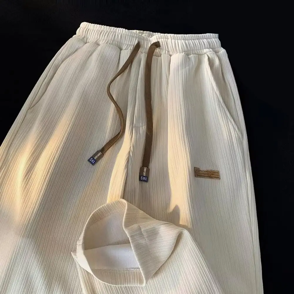 Description Picture 5 of itemMid-rise Elastic Waistband Men Pants Drawstring Pockets Ribbed Fast Drying Summer Ultra-thin Ice Silk Casual Trousers Streetwear