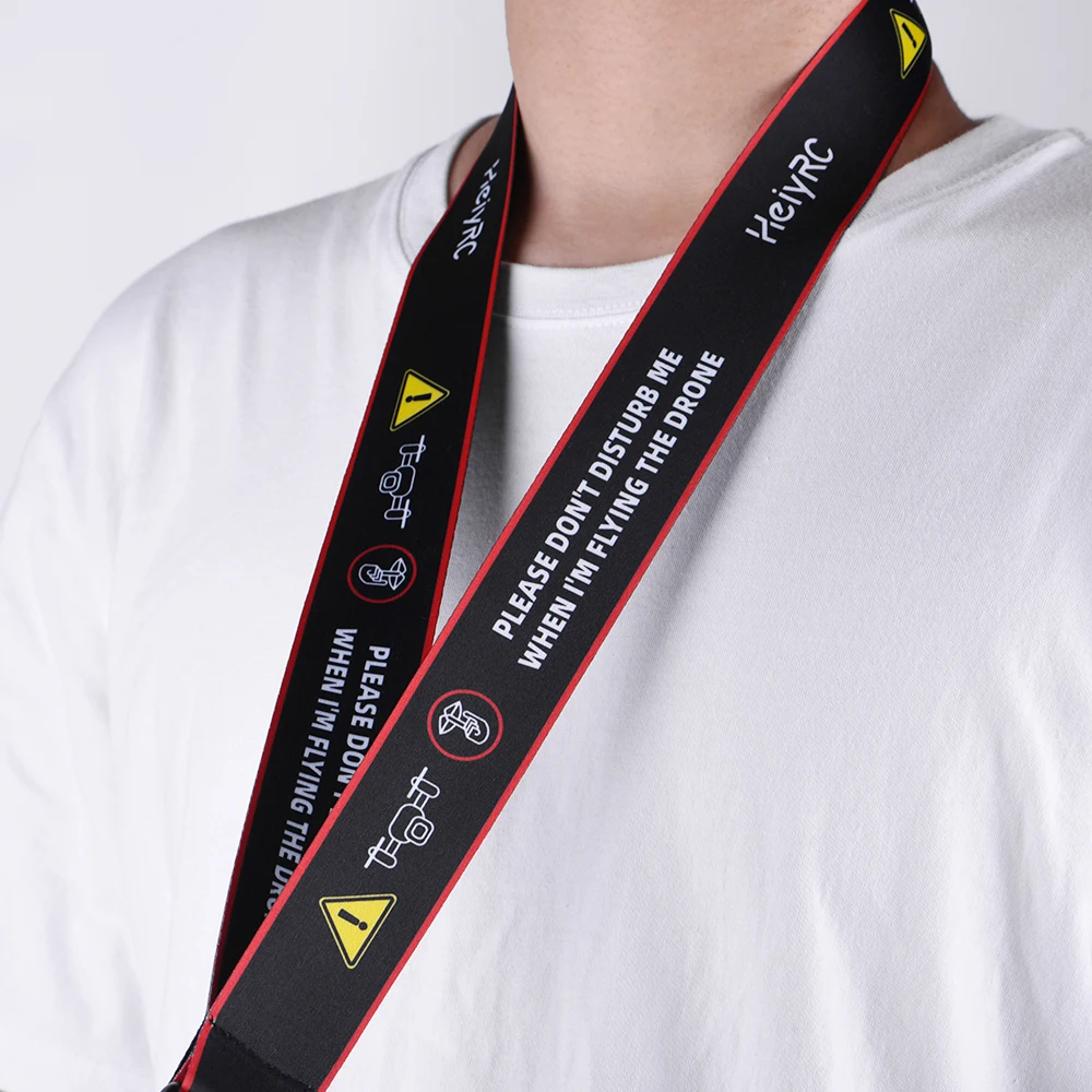 Bracelet de télécommande pour drone FPV Phantom 3/4, sangle de 64 cm enroulée sur elle-même, mettant en valeur la texture du tissu et les coutures renforcées.