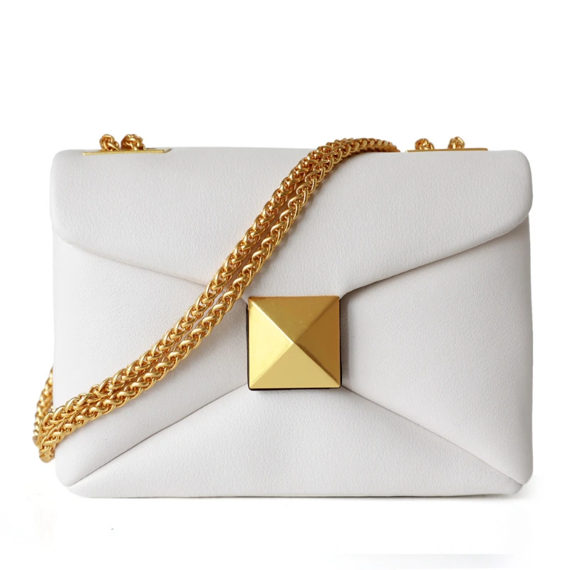 White purse with gold chains