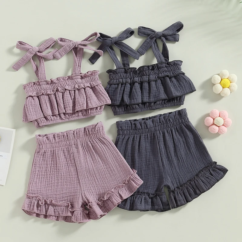 

2023-02-11 Lioraitiin 0-5Years Kids Girls 2Pcs Summer Clothes Outfits Solid Tie-Up Straps Ruffles Sleeveless Sling Tops Shorts