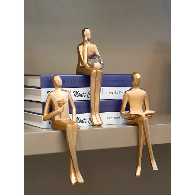 

Creative book cabinet ornaments villain sitting legs hanging feet doll desk bookshelf luxury modern decorations Nordic