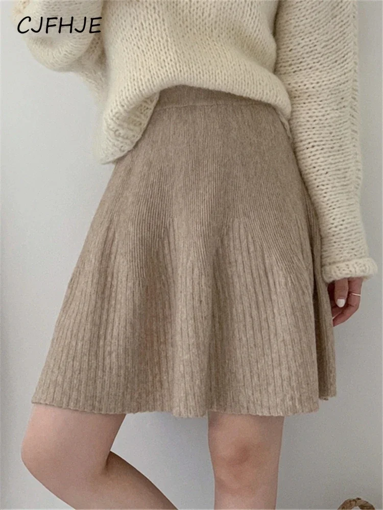 

CJFHJE New Women's Solid Color Pleated Skirt Half Skirt Winter Fashion Women A-line Umbrella Skirt Short Knitted College Style