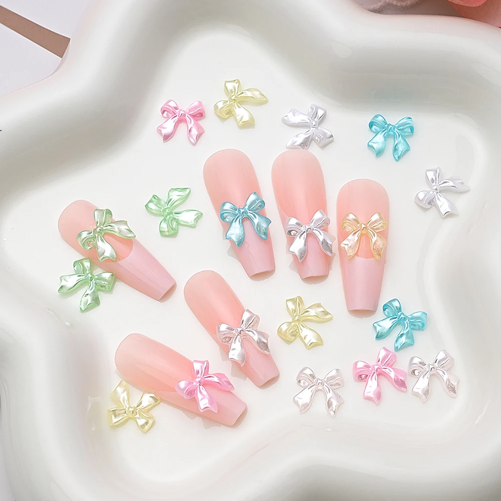 100Pcs 진주 흰색 광택 리본 활 네일 아트 매력 3D 우아한 Kawaii 수지 Bowknot 여름 네일 장식 매니큐어 Accessorie