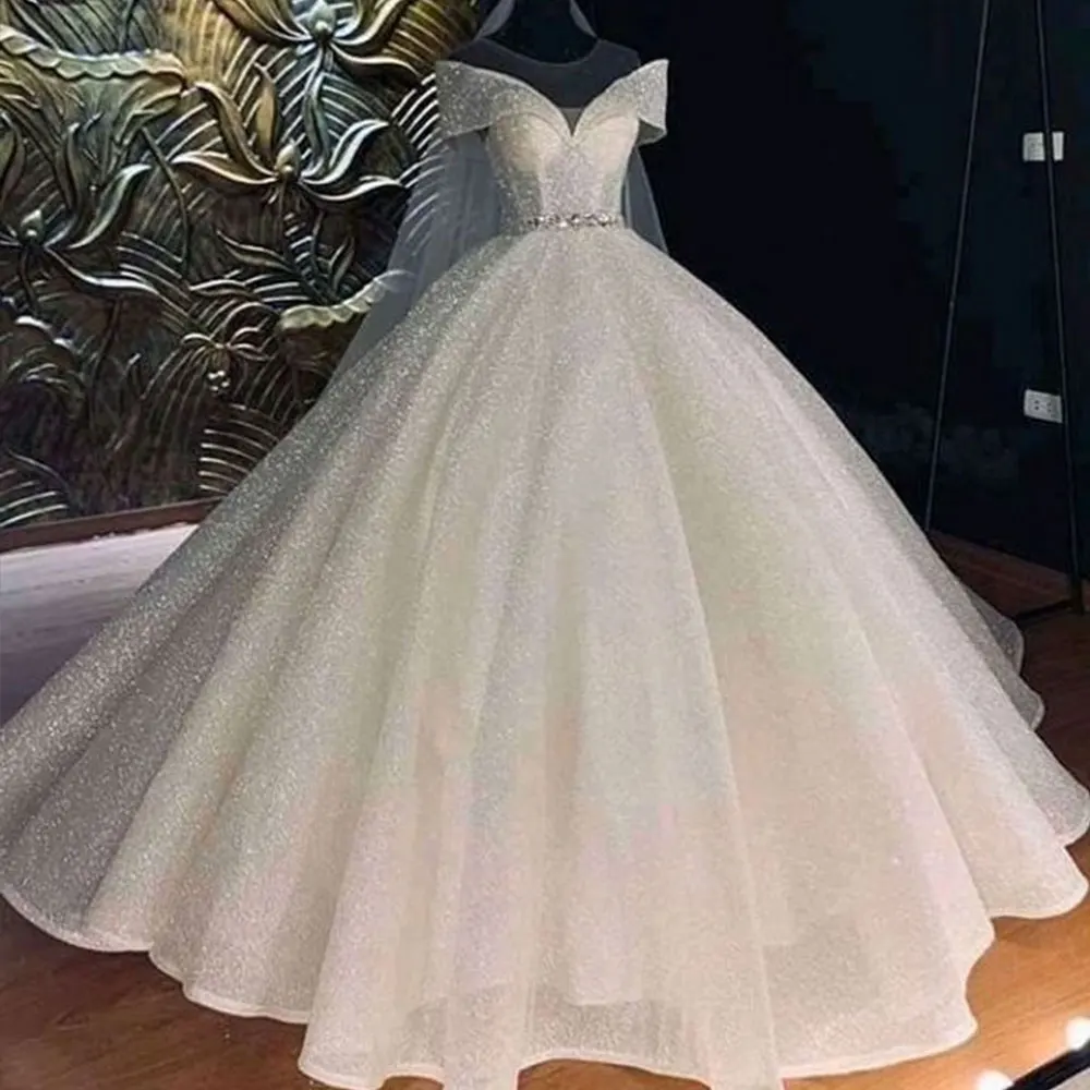 Luxury Crystals Glitter Sequined Wedding Dresses 2024 Sexy Sweetheart Neck Off Shoulder Short Sleeves Princess Bride Ball Gowns