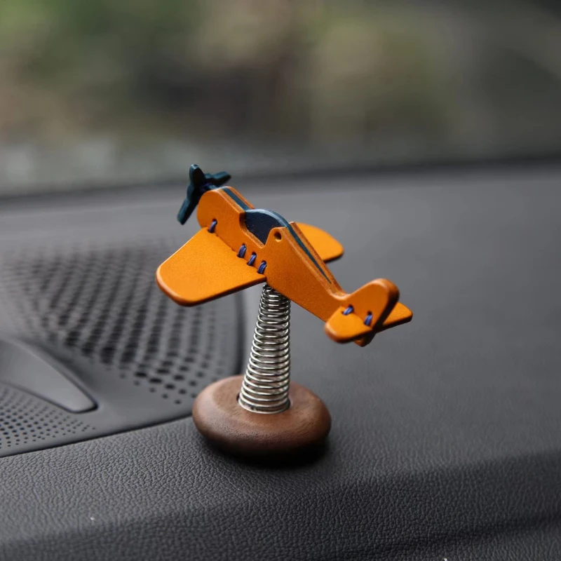 

Yu Handmade Leather Small Aircraft Car Spring Decoration Black Walnut Wooden Base