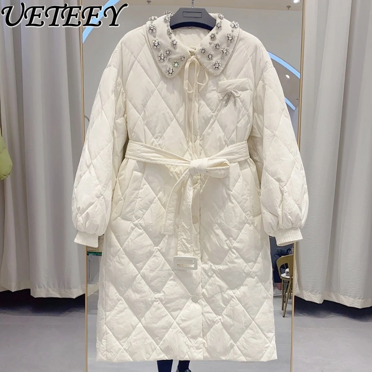 Рисунок 2 - Женский пуховик средней длины