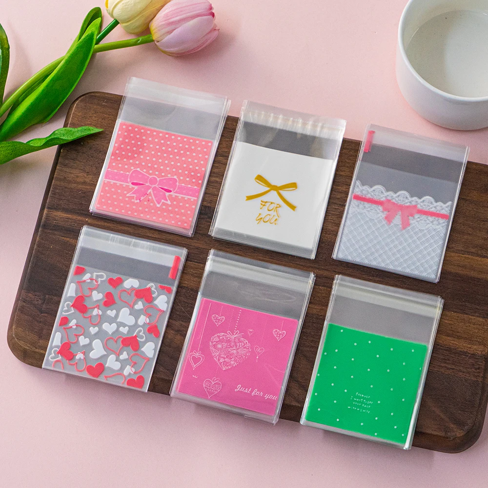 100 Stücke 7x7 cm Mehrere Stile Kunststoff Selbstdichtende Süßigkeiten Cookie Tasche Für Schmuck Party Geschenk Verpackung Großhandel kleine Unternehmen