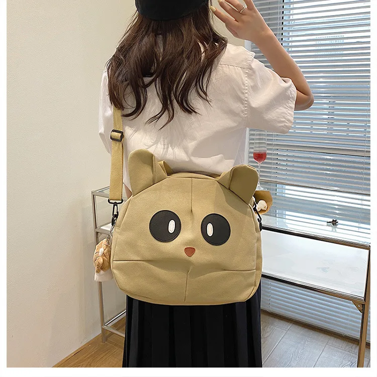 beige color cat themed tote bags with ears and big eyes