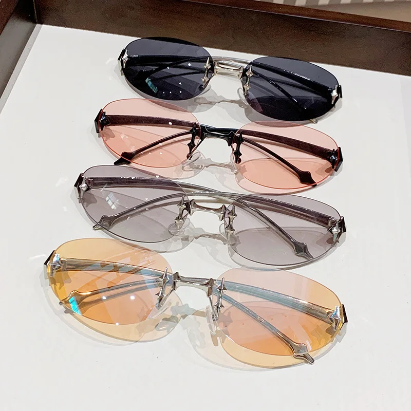 Y2K rimless elliptical fashion sunglasses with tinted lenses