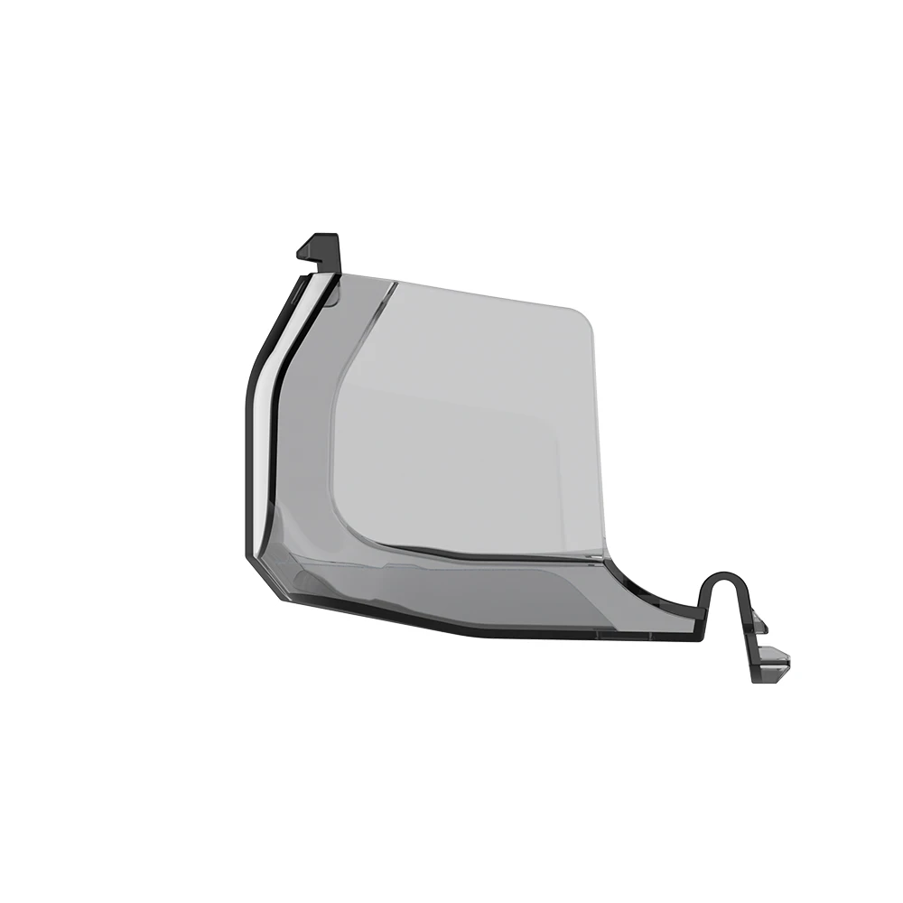 Protection d'Objectif de Cardan FIMI X8 MINI 3 & V2 posée sur une surface, couvercle anti-poussière en plastique transparent.