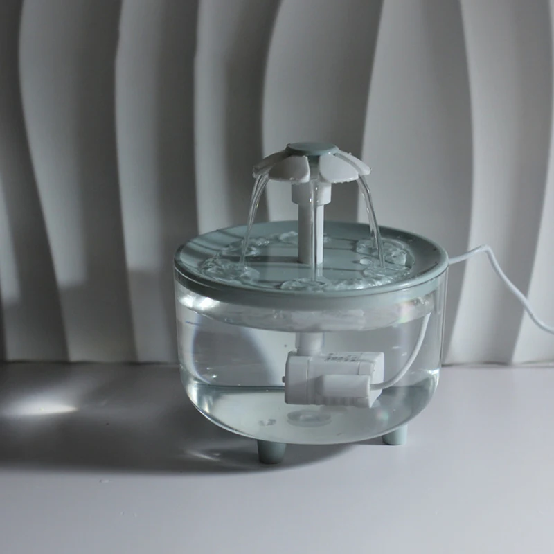 thumbnail image 1 of Fuente de agua para mascotas con circulación automática, dispensador de agua silencioso para gatos y perros, filtro de agua transparente con pétalos, apagado automático por corte de energía, 1 of 5