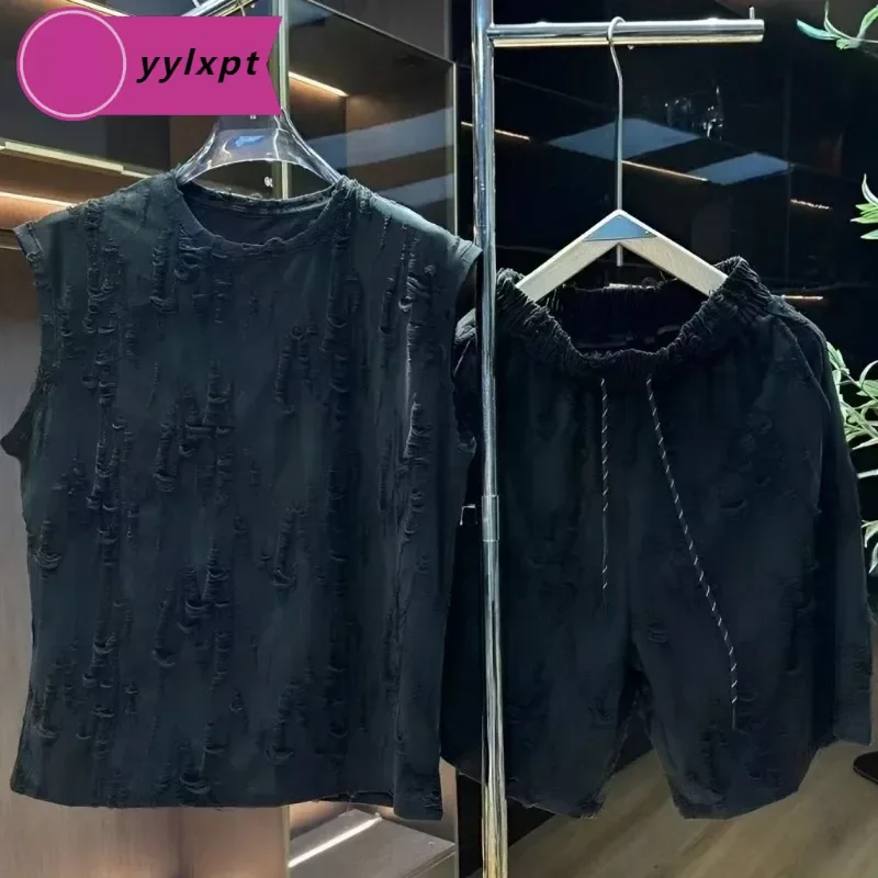 

Summer thin hole hollow breathable leisure suit men's trendy brand handsome loose sleeveless T-shirt shorts two-piece.