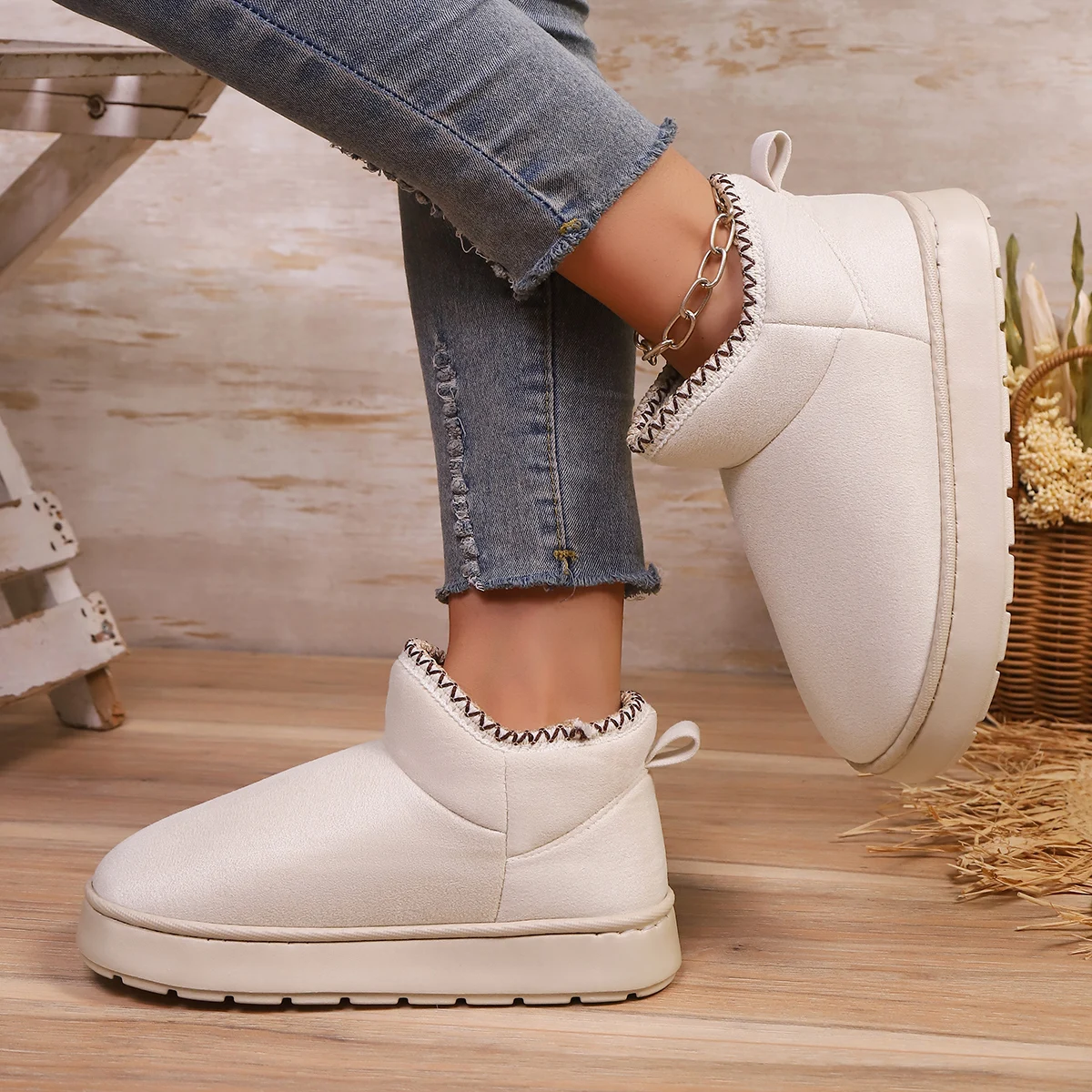 Woman wearing EvaCozy warm winter slippers at home in Canada