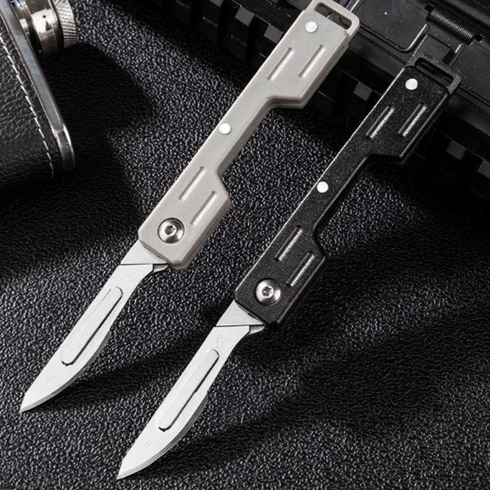 Compact folding scalpel knife displayed on a neutral background