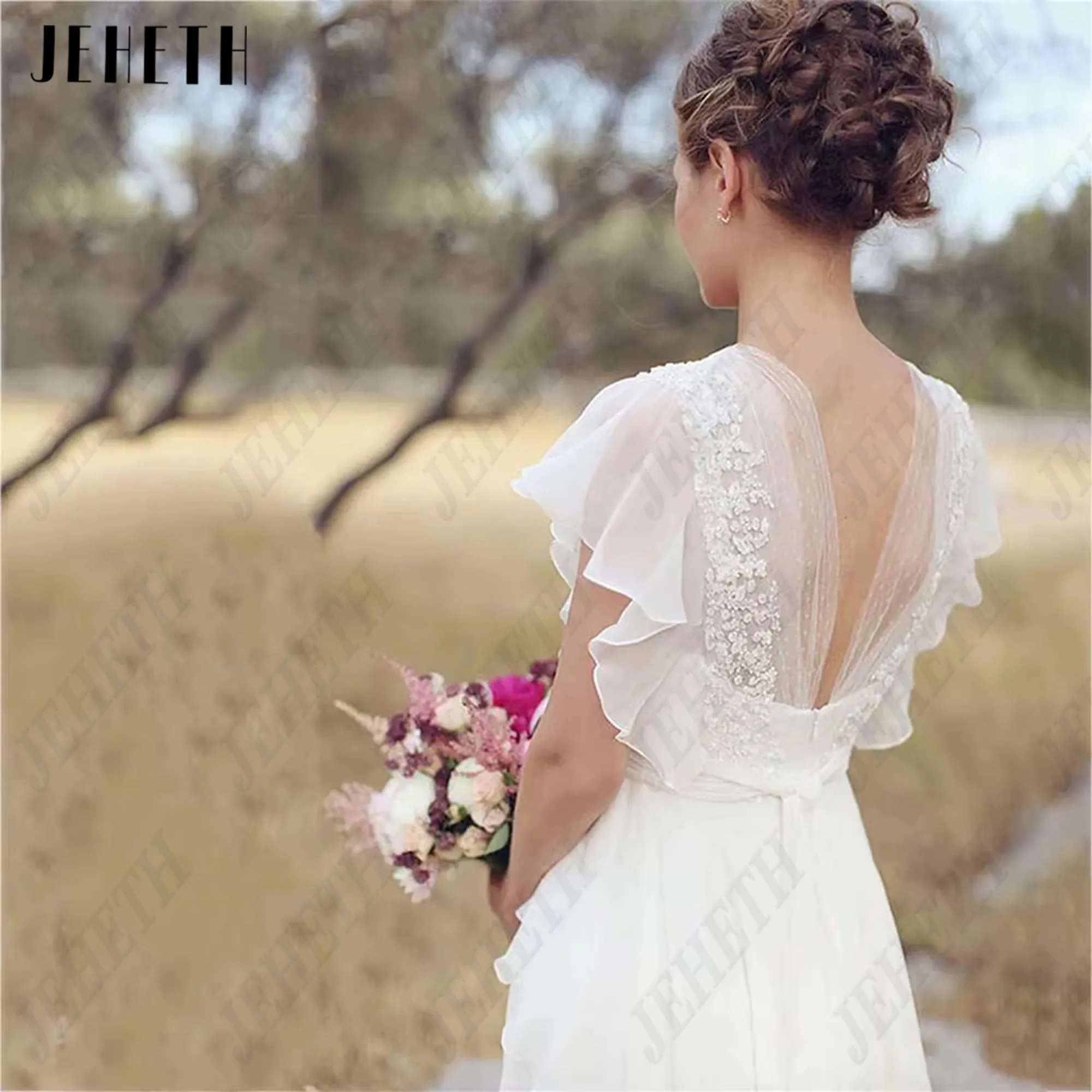JEHETH v 넥 웨딩 드레스 쉬폰 라인 반팔 백리스 바닥 길이 프릴 비치 브라 가운 보헤미안 맞춤형 JEHETH V-Neck 결혼식 드레스 시폰 A 라인 짧은 소매 백레스 바닥 길이 러플 해변 신부 드레스