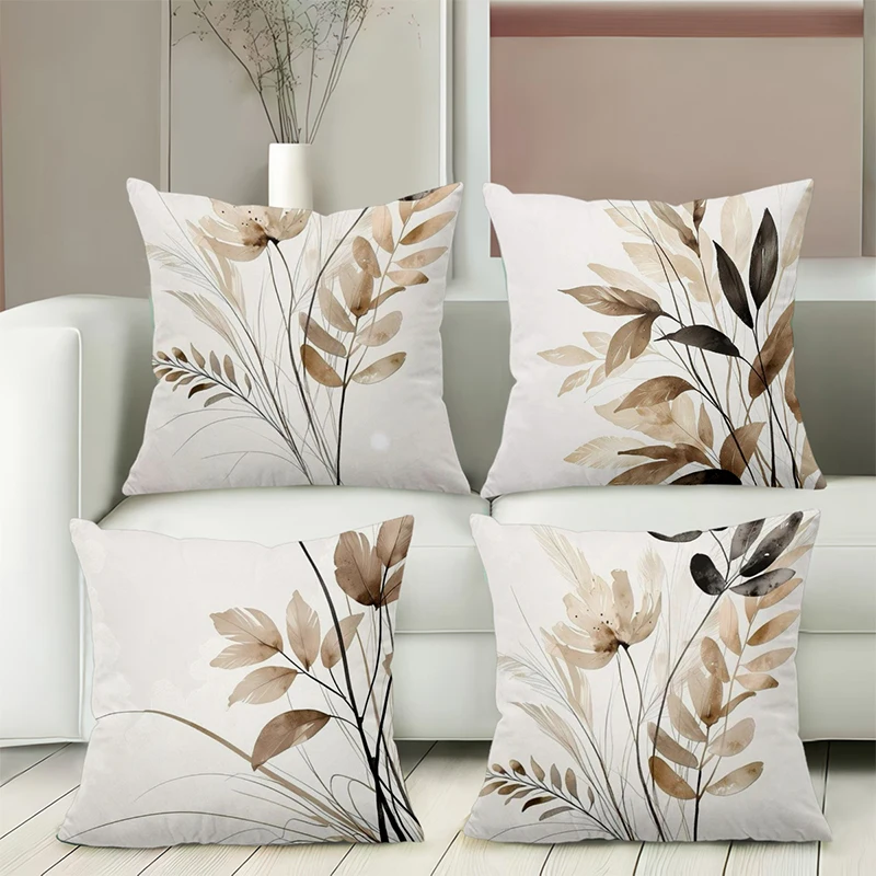 Neutral floral leaf pillow covers styled on a sofa