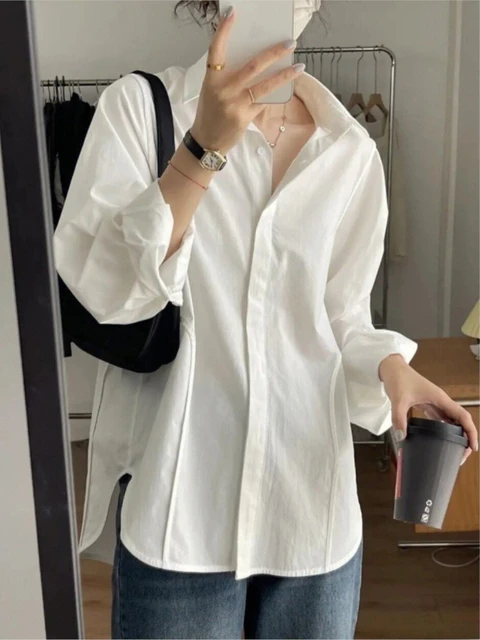 Loose white shirt with large cuffs