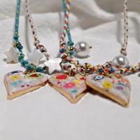 Collier avec pendentif en forme de cœur en corde nouée à la main, chaîne de pull à la mode, collier de perles étoiles empilables pour femmes, nouveau Design de bijoux 4