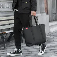 Sac à main pour homme, sac fourre-tout japonais en tissu Oxford, sacs à bandoulière tendance pour homme, sac de luxe de créateur 2026, grand sac décontracté noir pour étudiant 1