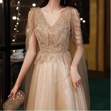 

Champagne Gold Evening Dresses With Cape A Line Sexy V-neck A-line Shiny Luxury Beading Shawl Formal Celebrity Prom Gowns New