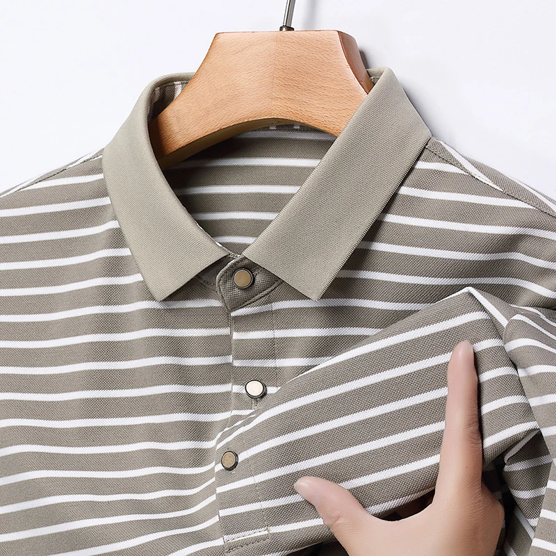 Detailed view of the anti-wrinkle knit fabric and striped pattern on the short-sleeved polo.