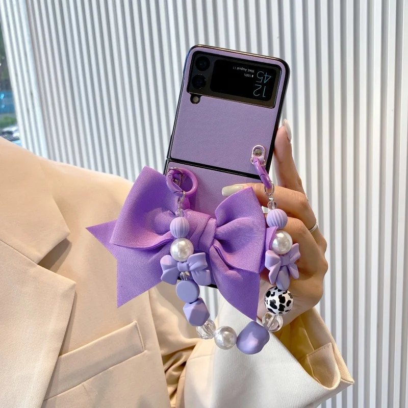 

Cute Bowknot Phone Case for Samsung Galaxy Z Flip 3 4 5G Luxury Leather Cover with Wrist Strap for Women Bracelet Case for Flip4