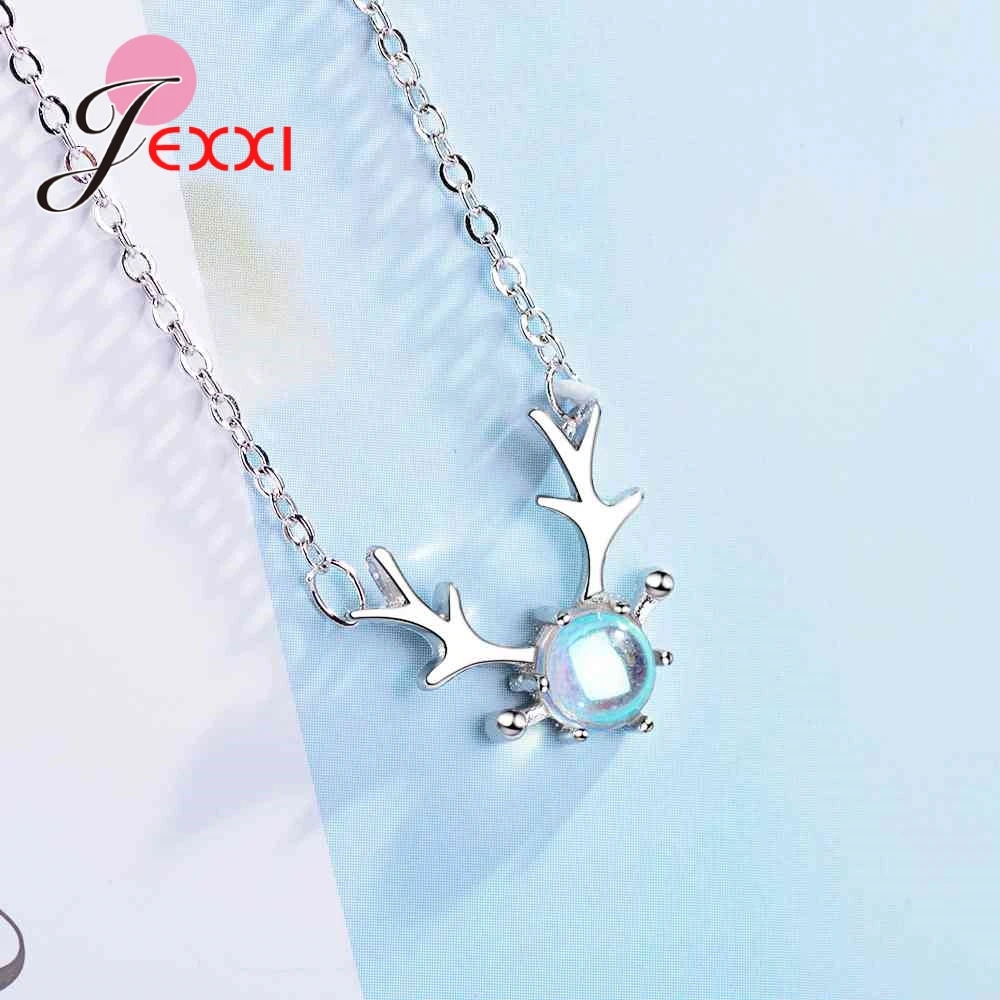 Sterling silver deer antler necklace featuring a central iridescent blue moonstone gemstone.